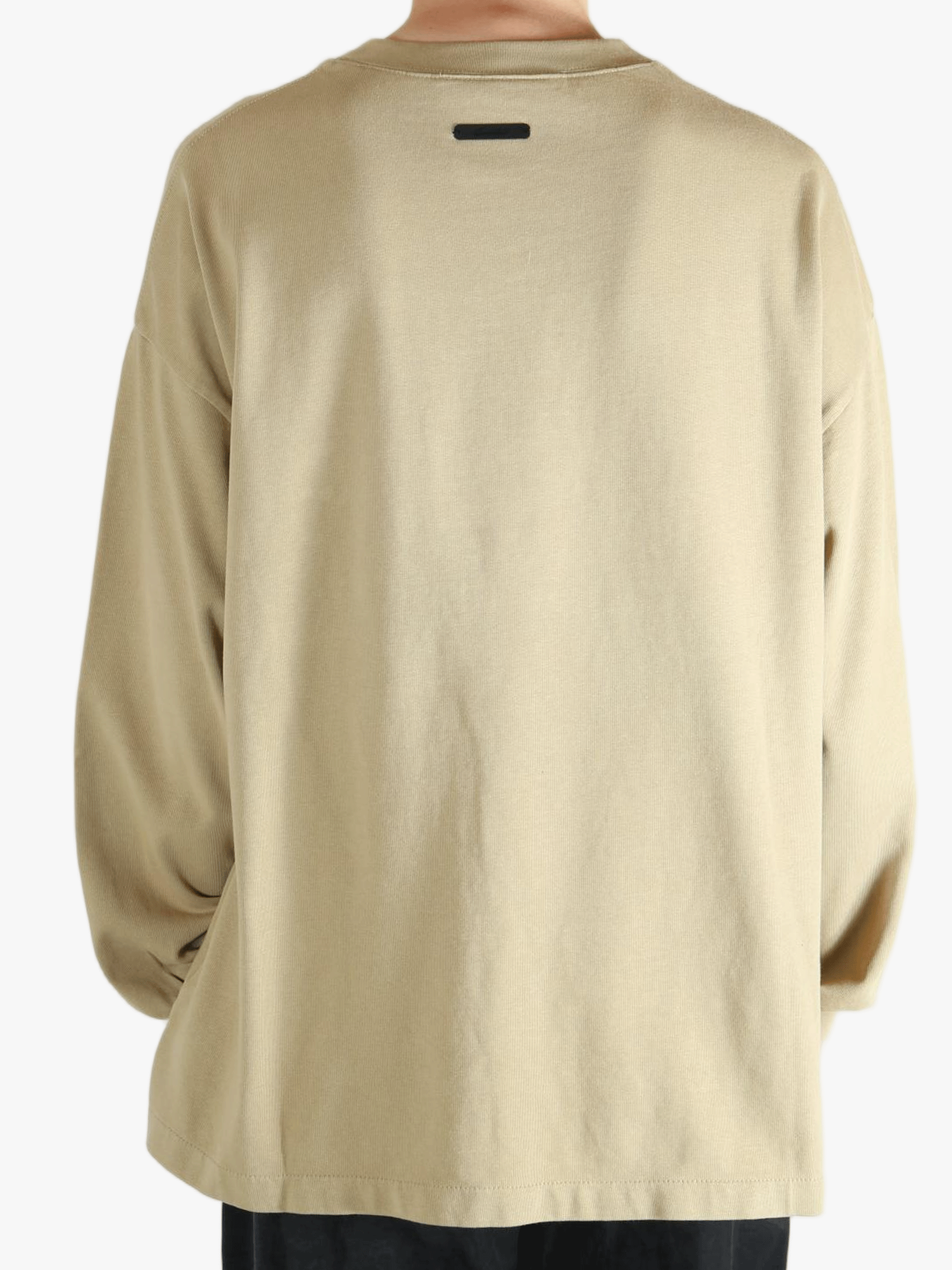 Tan t-shirt worn by a person, showing the t-shirt's fit