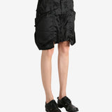 Black shorts worn by a person, showing the shorts's fit