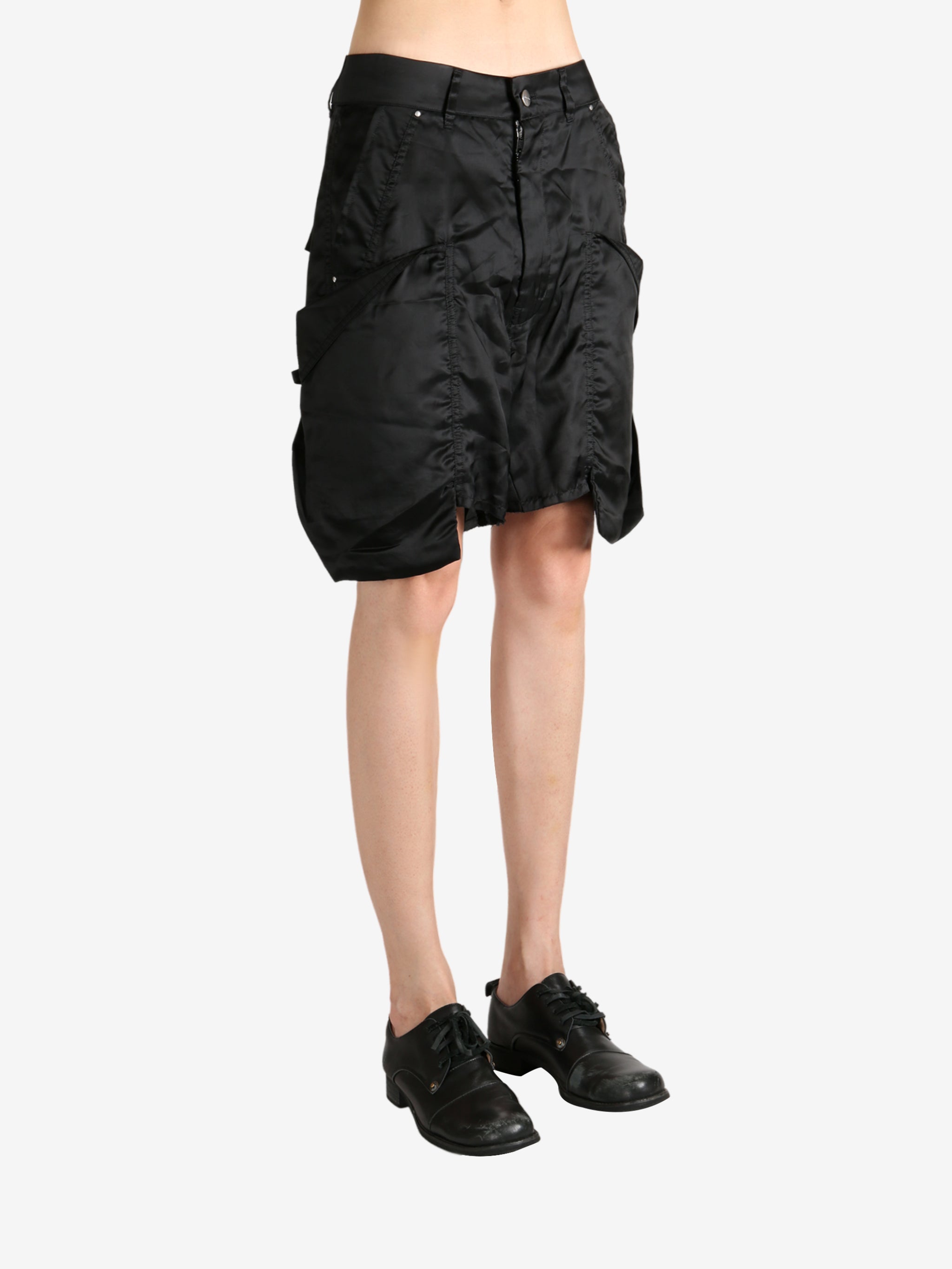 Black shorts worn by a person, showing the shorts's fit