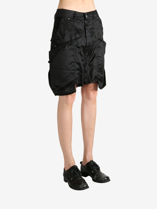 Black shorts worn by a person, showing the shorts's fit