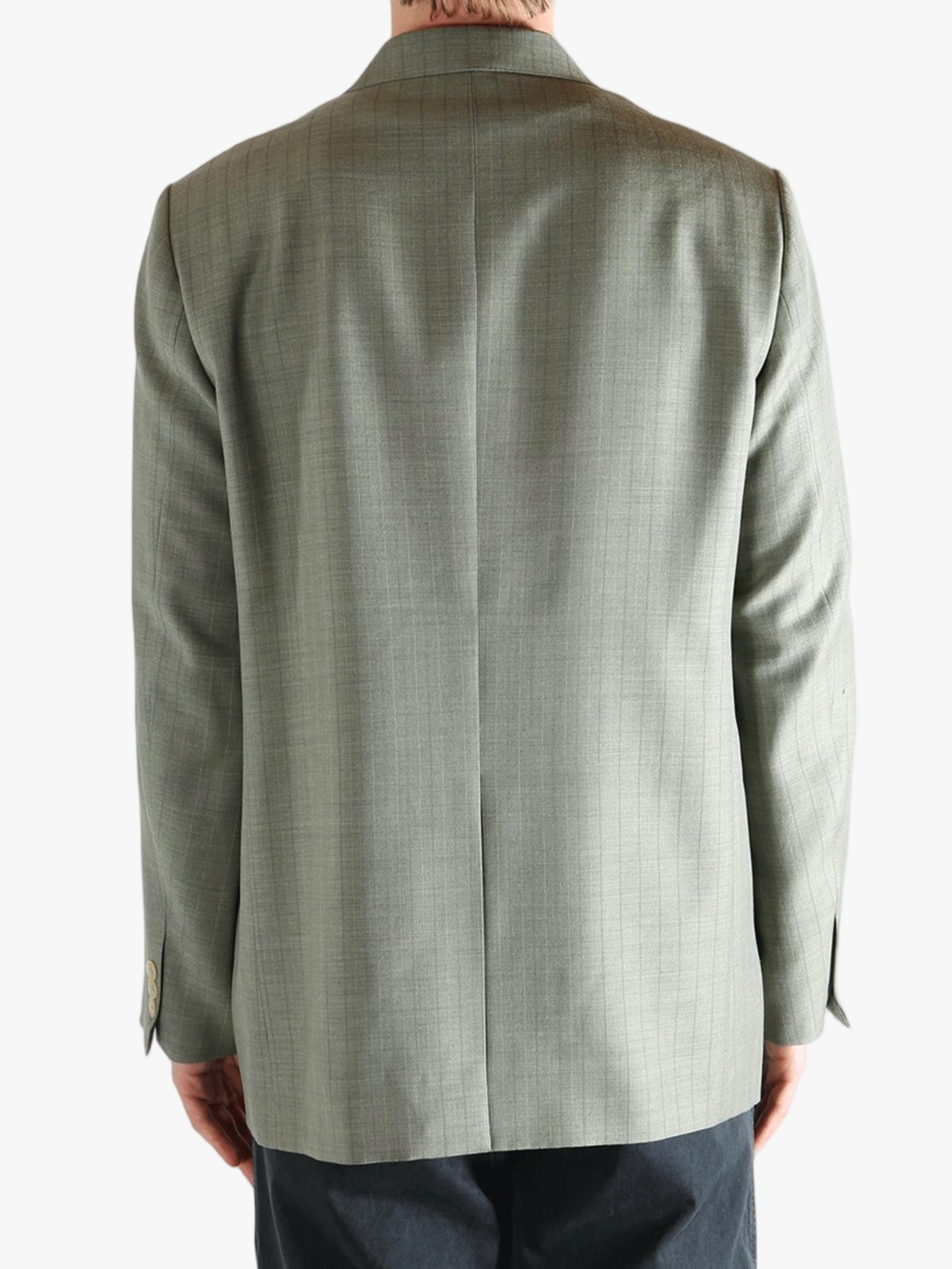 Green jacket worn by a person, showing the jacket's fit