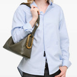 Green bag worn by a person, showing the bag fit