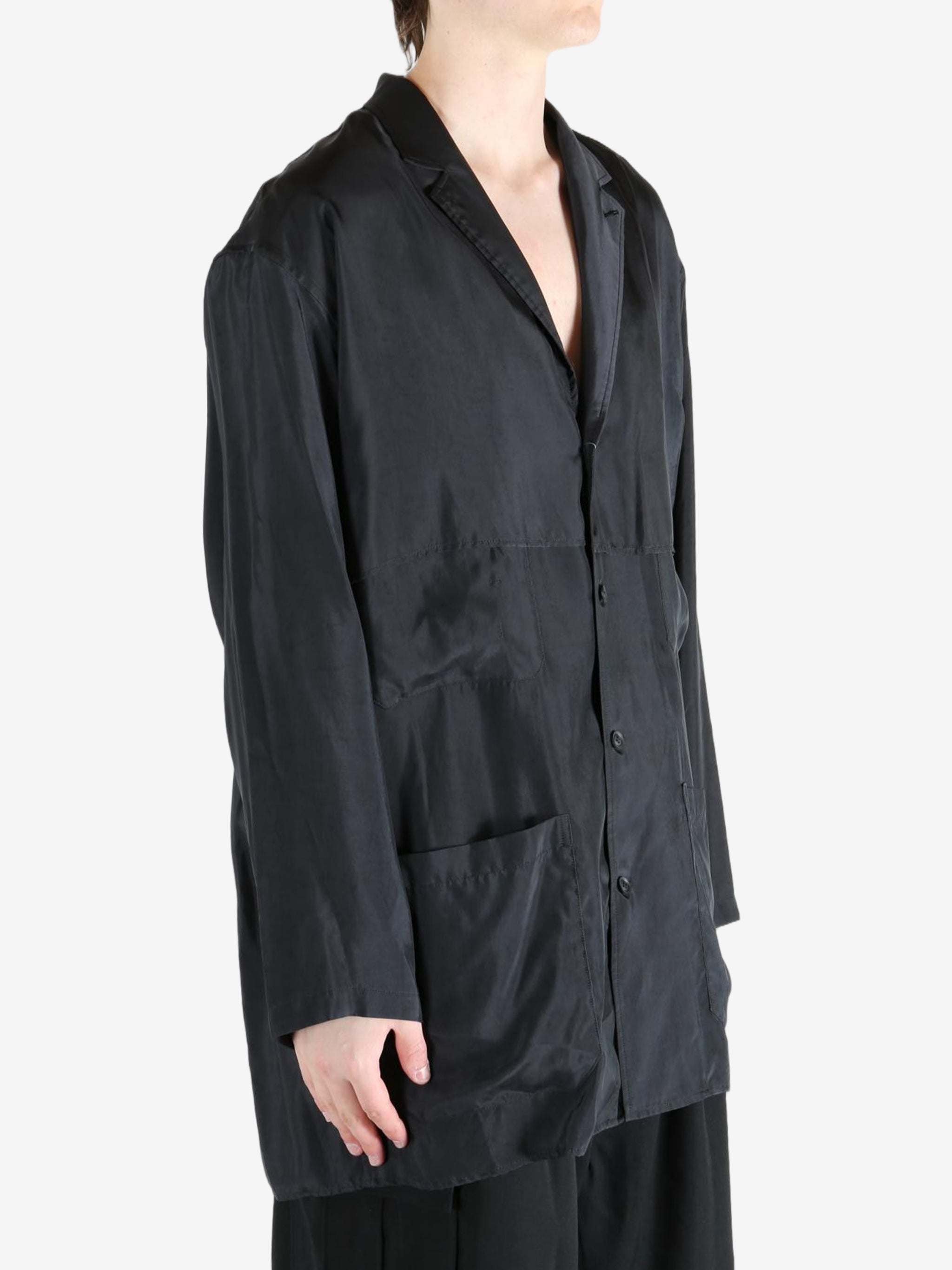 Black shirt,worn by a person, showing the shirt's fit