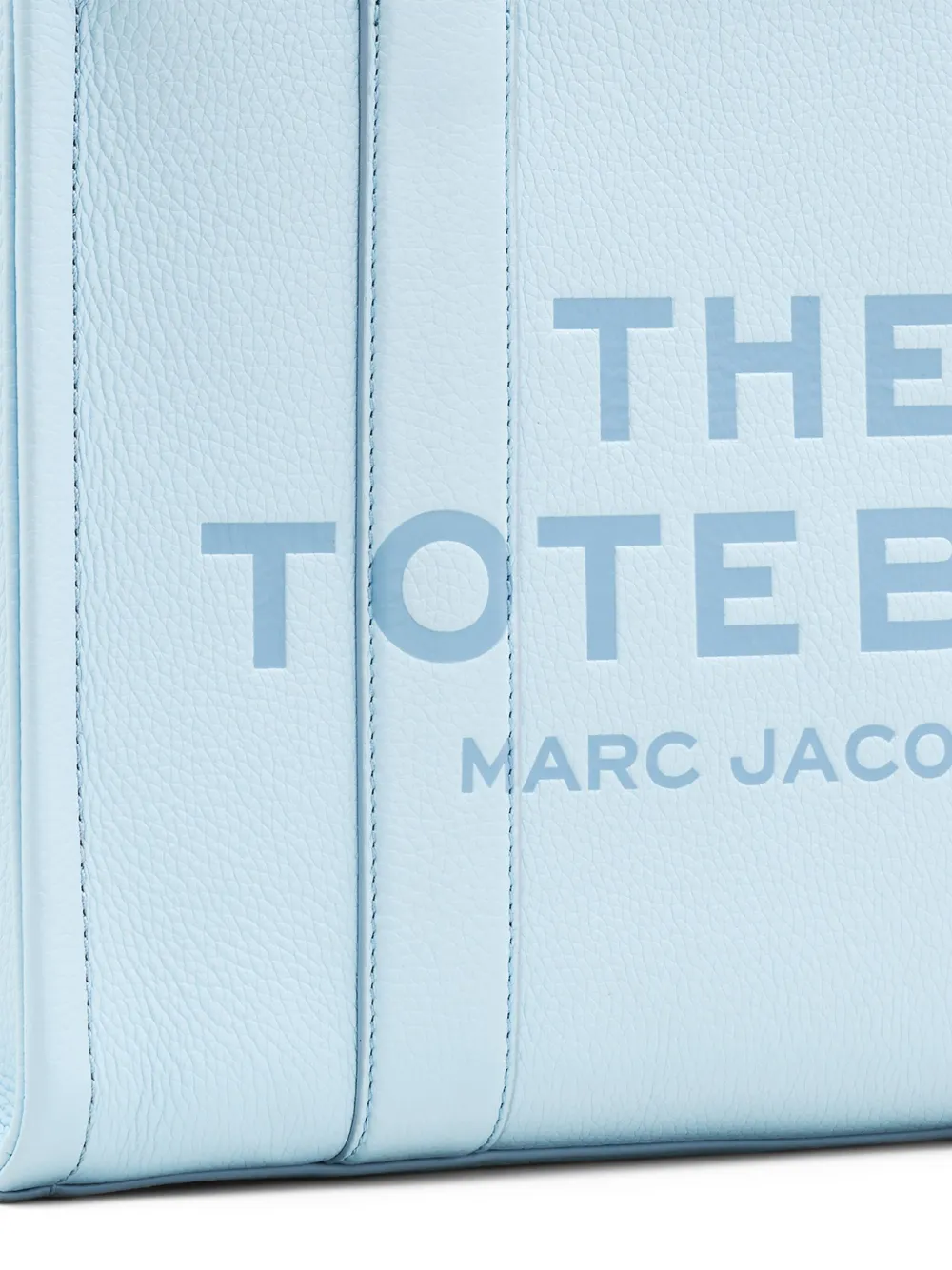 close up of blue bags, showing texture of the leather fabric