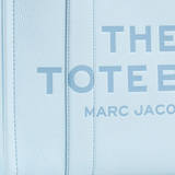 close up of blue bags, showing texture of the leather fabric