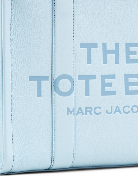 close up of blue bags, showing texture of the leather fabric