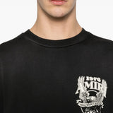 Close up of the black t-shirt, showing texture of the cotton fabric