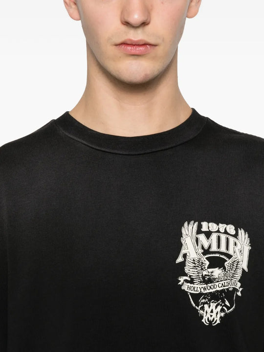 Close up of the black t-shirt, showing texture of the cotton fabric