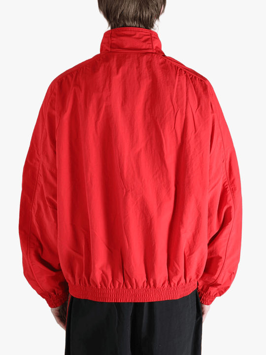 Red jacket worn by a person,showing the jacket fit