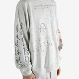 Grey top worn by a person, showing the top fit