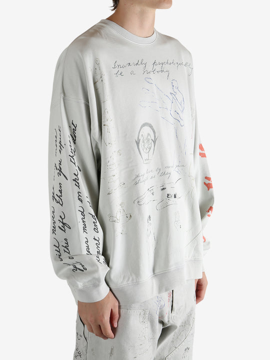 Grey top worn by a person, showing the top fit