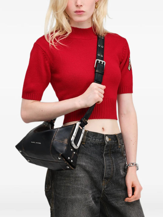 Black bag worn by a person, showing the bag fit