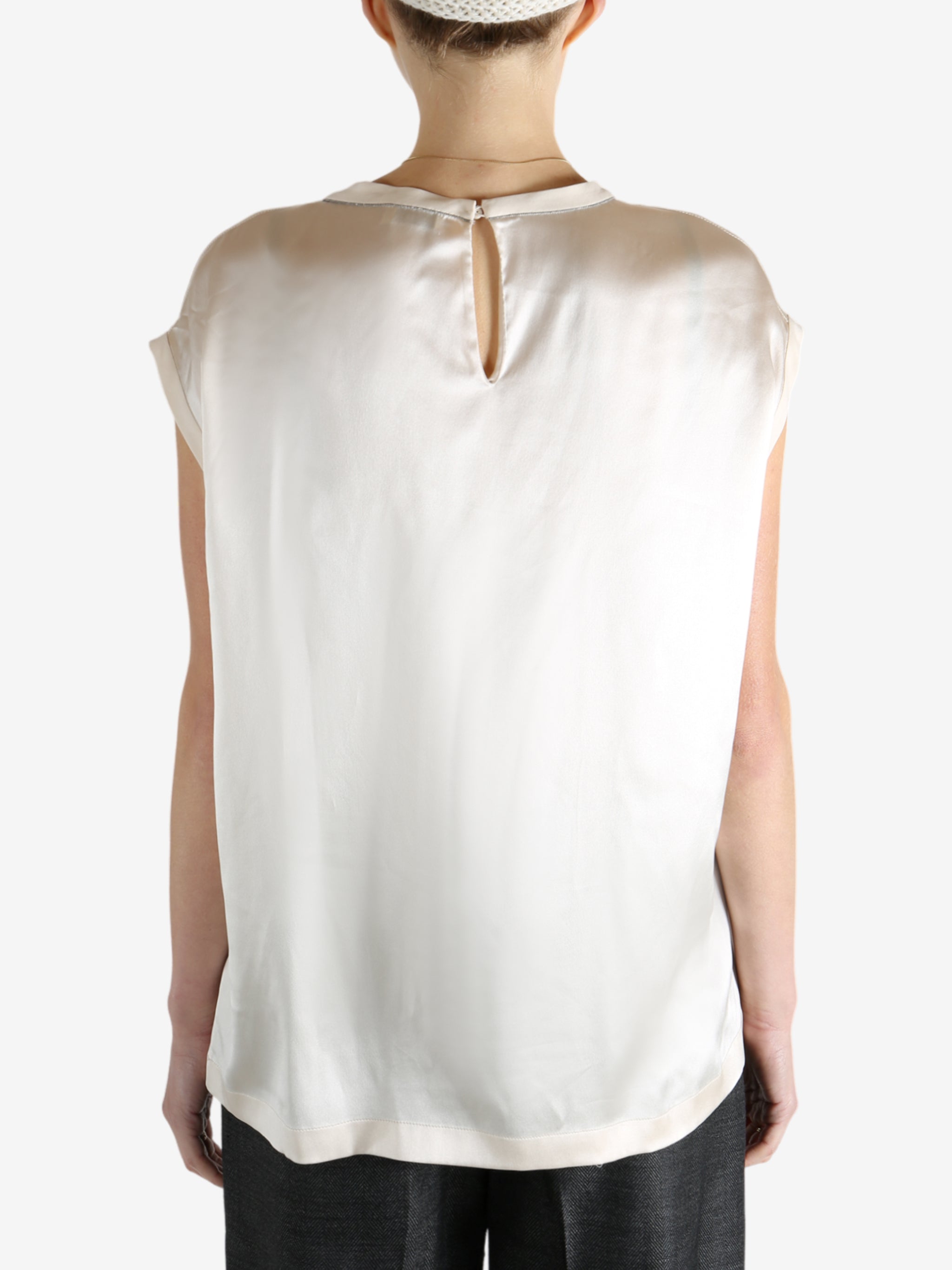 Grey t-shirts worn by a person, showing the t-shirts fit