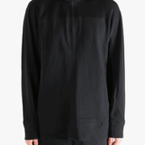 Black jacket worn by a person, showing jacket's fit
