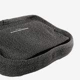 Close up of black bags, showing texture of the fabric