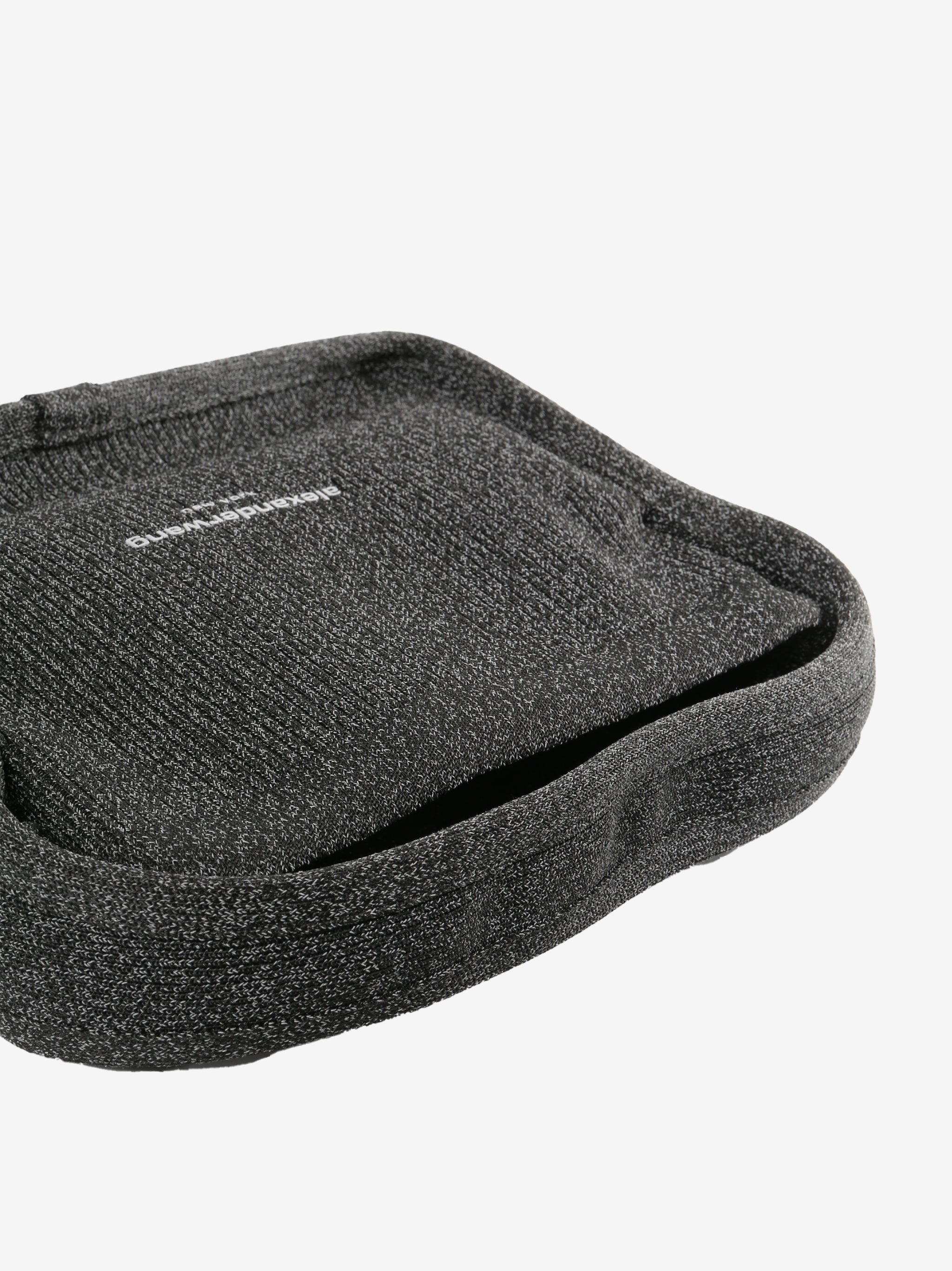 Close up of black bags, showing texture of the fabric