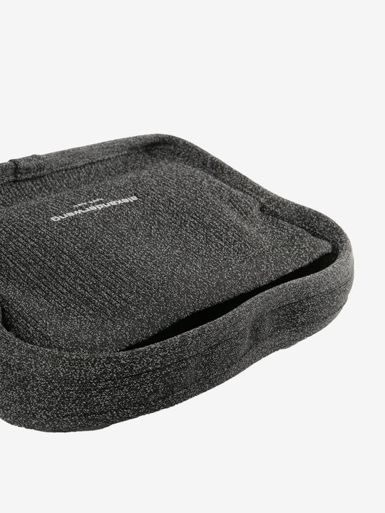 Close up of black bags, showing texture of the fabric