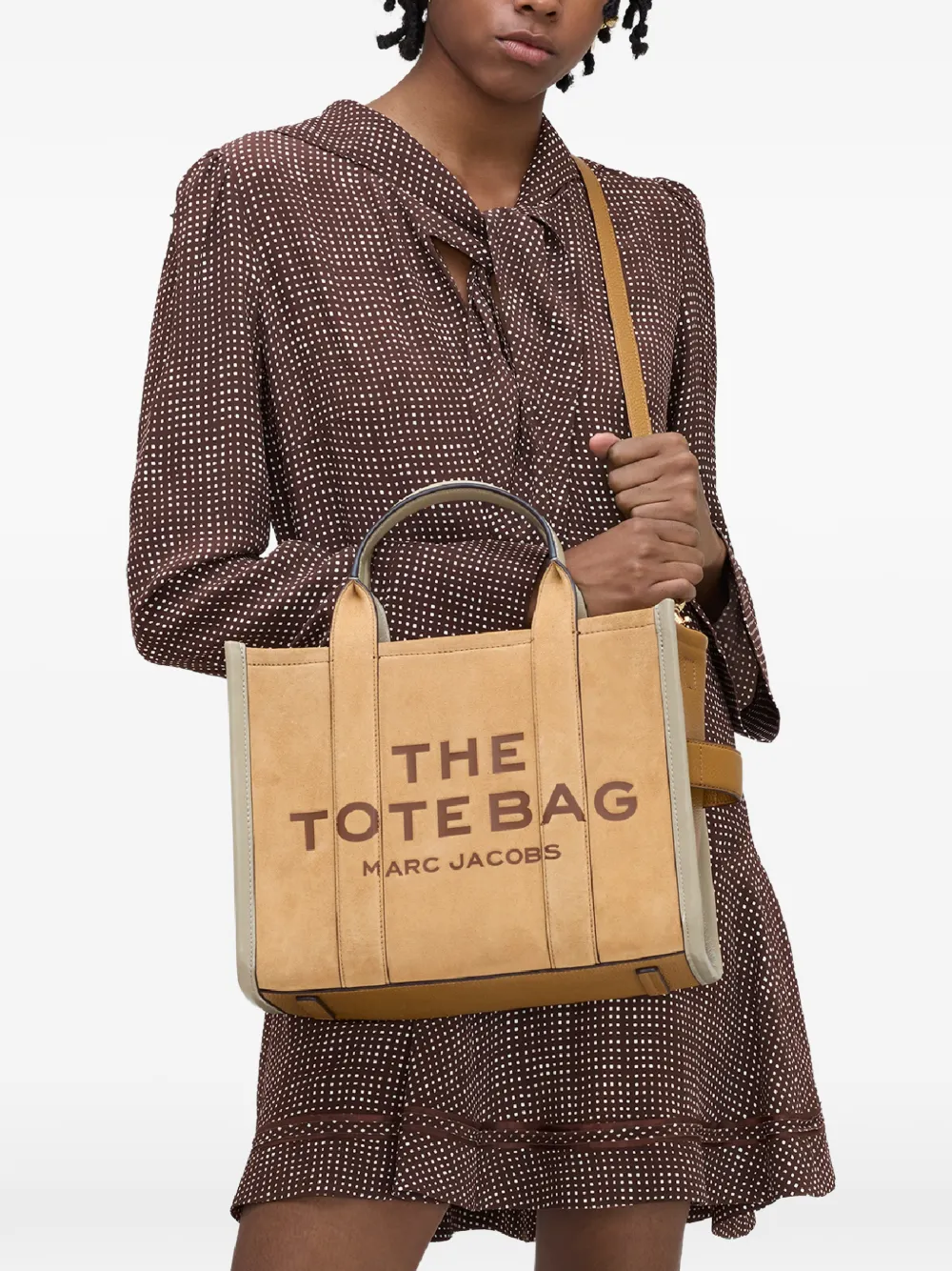 brown bags worn by a person, showing the bags fit