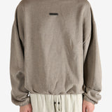 Tan tops worn by a person, showing the tops fit