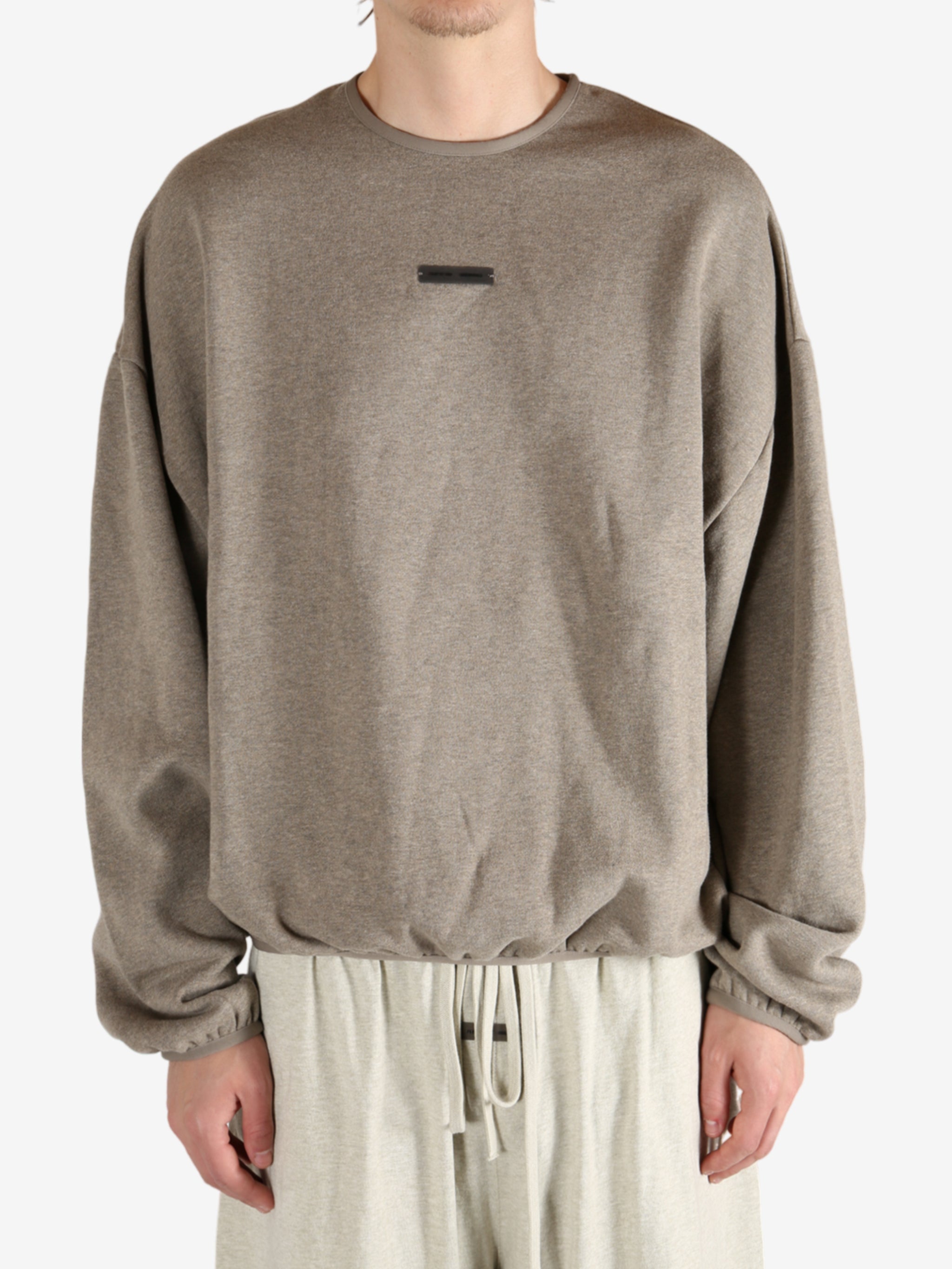 Tan tops worn by a person, showing the tops fit