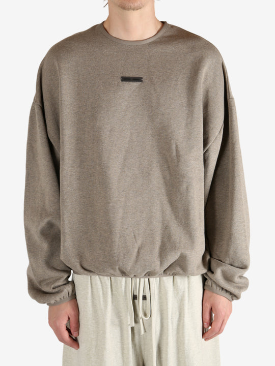 Tan tops worn by a person, showing the tops fit