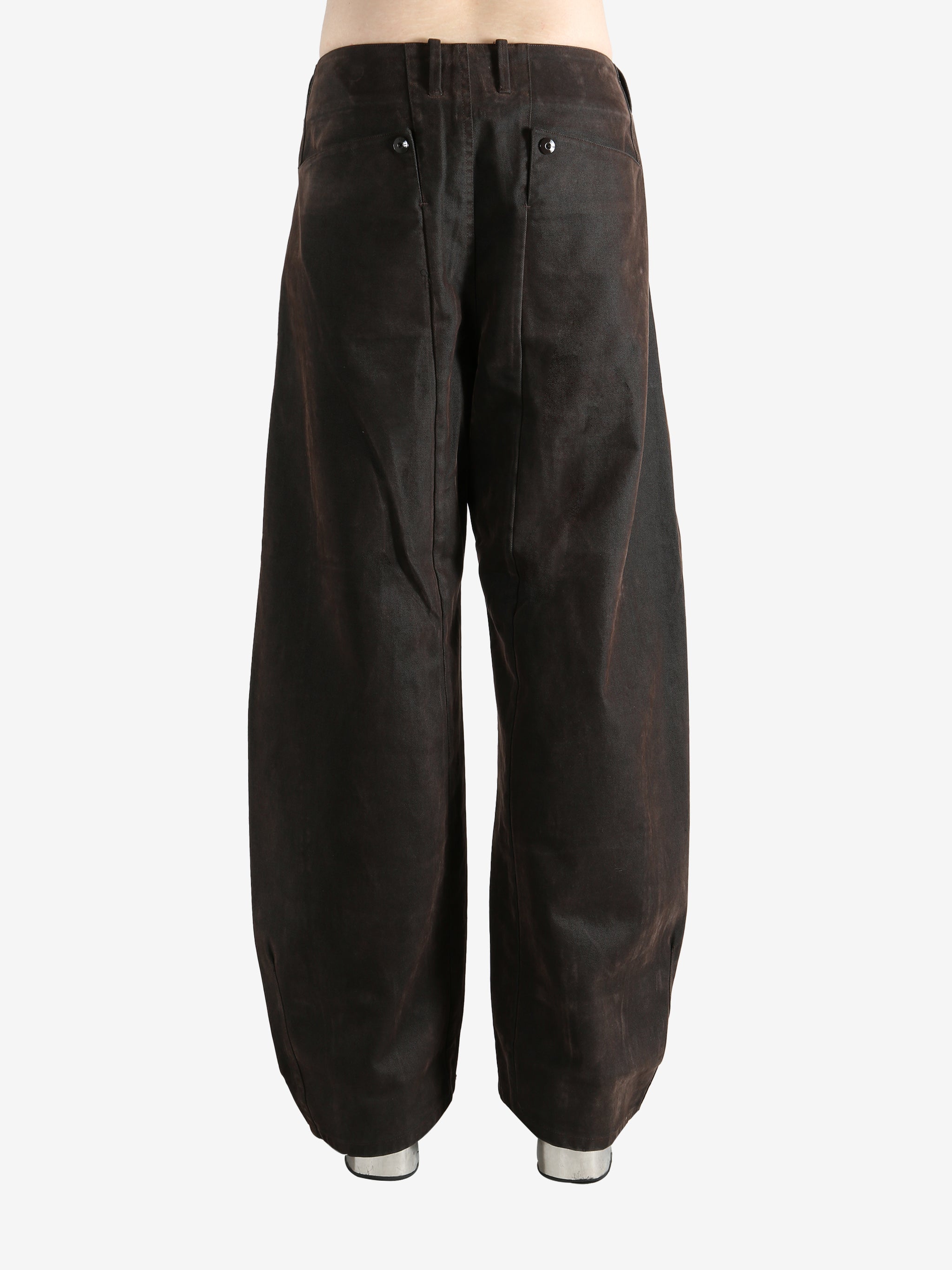 Brown pants worn by a person, showing the pants fit