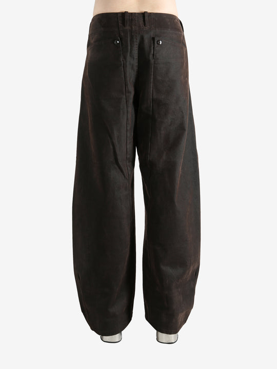 Brown pants worn by a person, showing the pants fit