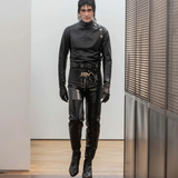 Black belt worn by a person, showing the belt's fit