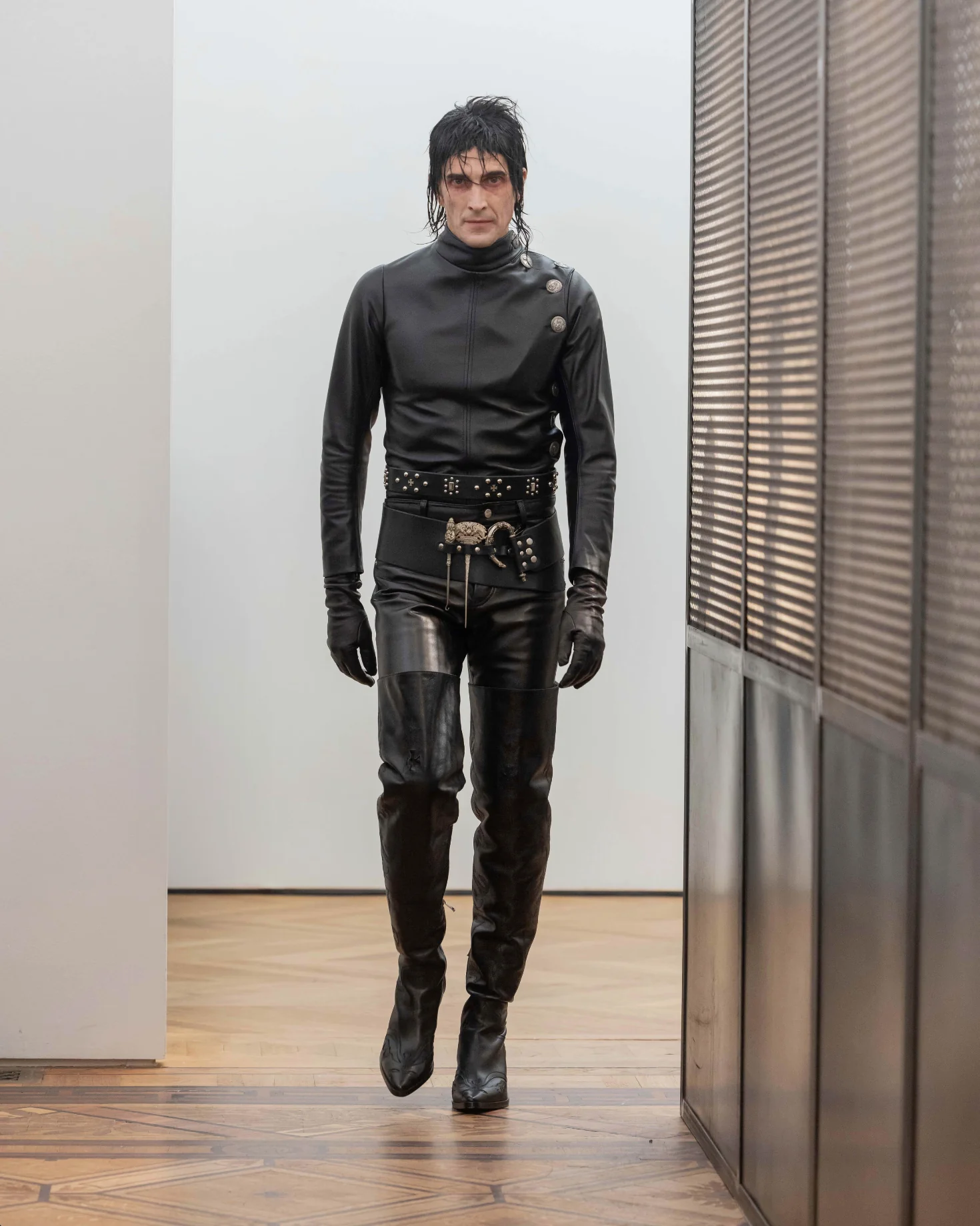 Black belt worn by a person, showing the belt's fit