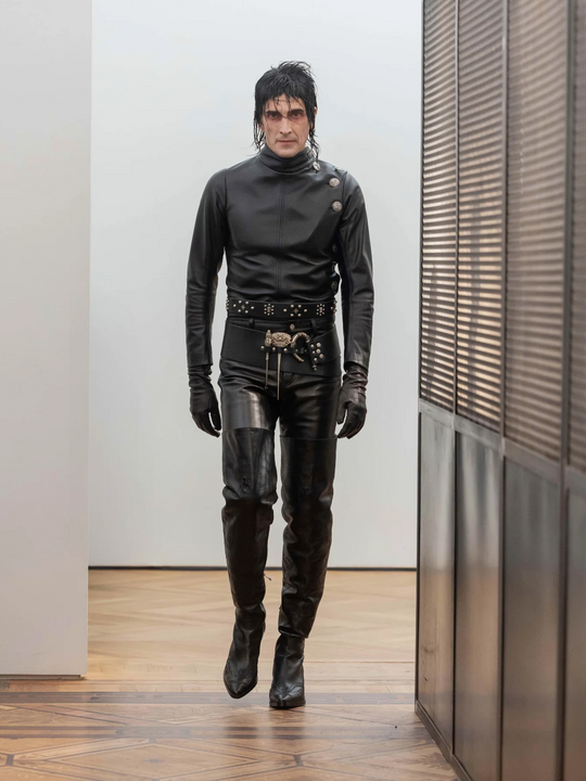 Black belt worn by a person, showing the belt's fit