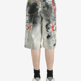 White shorts worn by a person, showing the shorts's fit