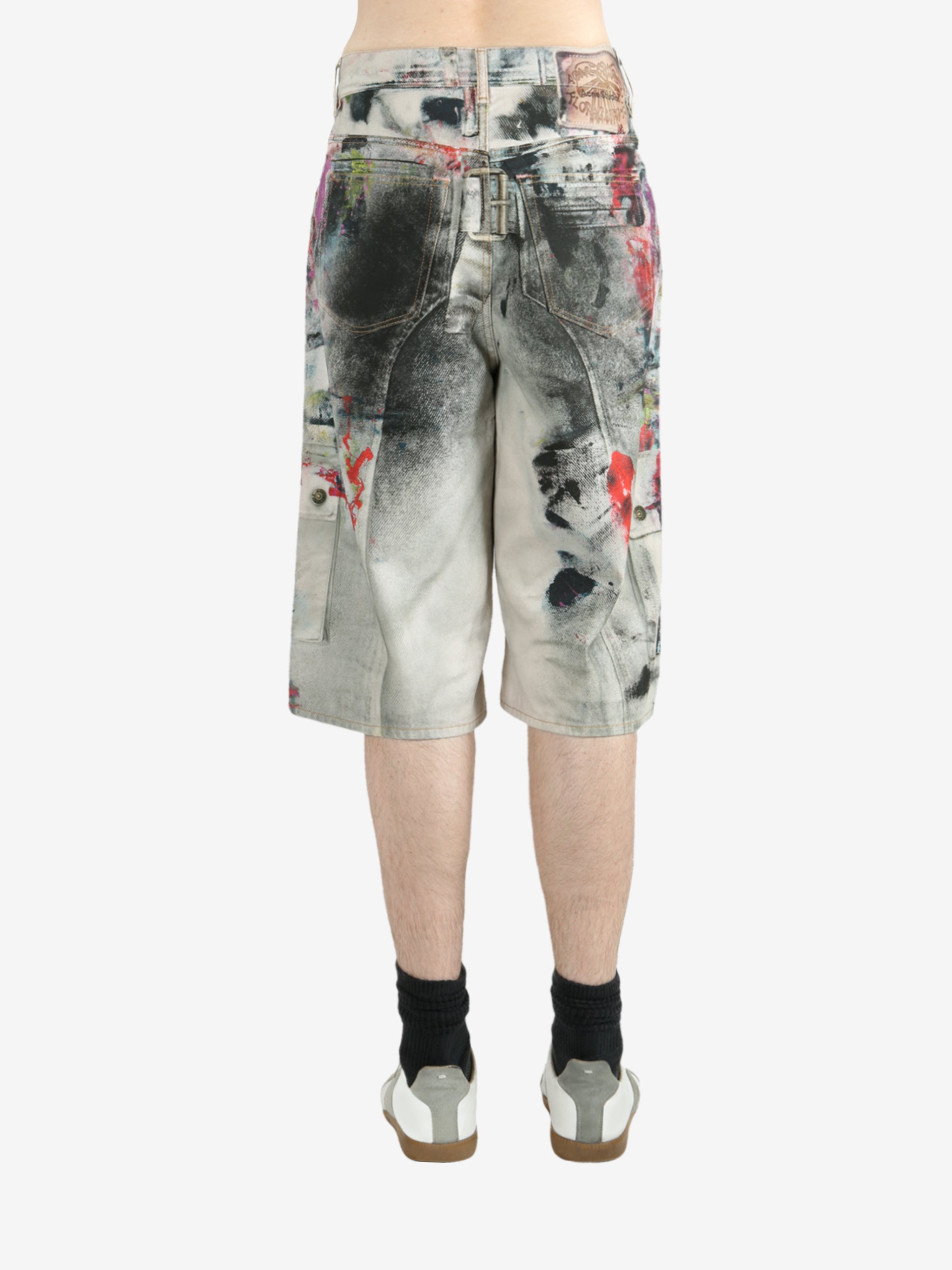 White shorts worn by a person, showing the shorts's fit