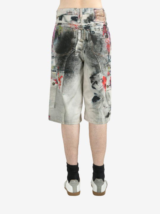 White shorts worn by a person, showing the shorts's fit