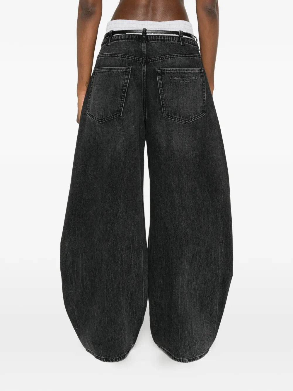 Grey jeans worn by a person, showing the jeans fit