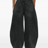Grey jeans worn by a person, showing the jeans fit