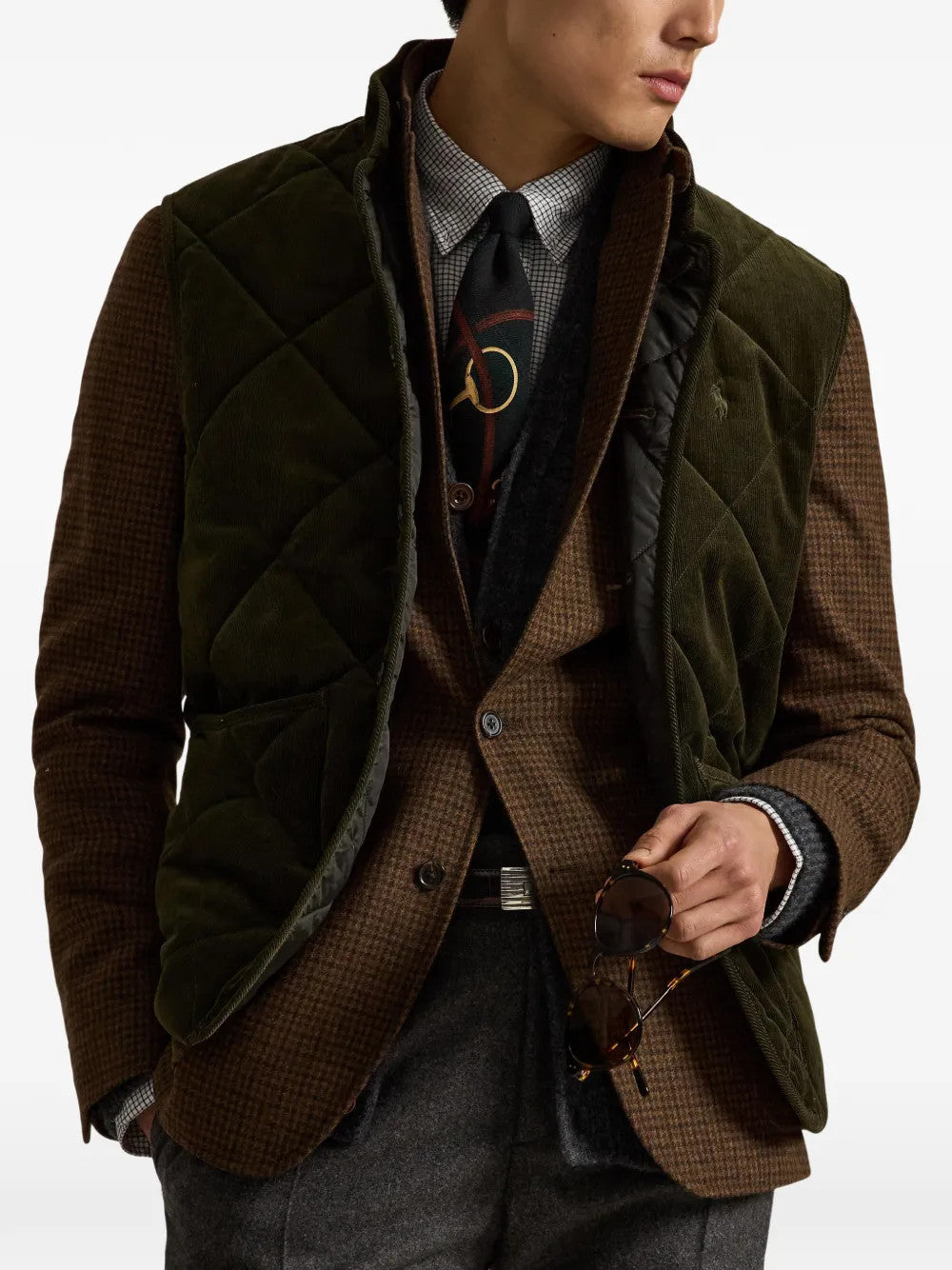 Green jacket worn by a person, showing the jacket fit