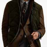 Green jacket worn by a person, showing the jacket fit