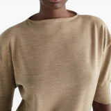 Tan knitwear worn by a person, showing the knitwear fit