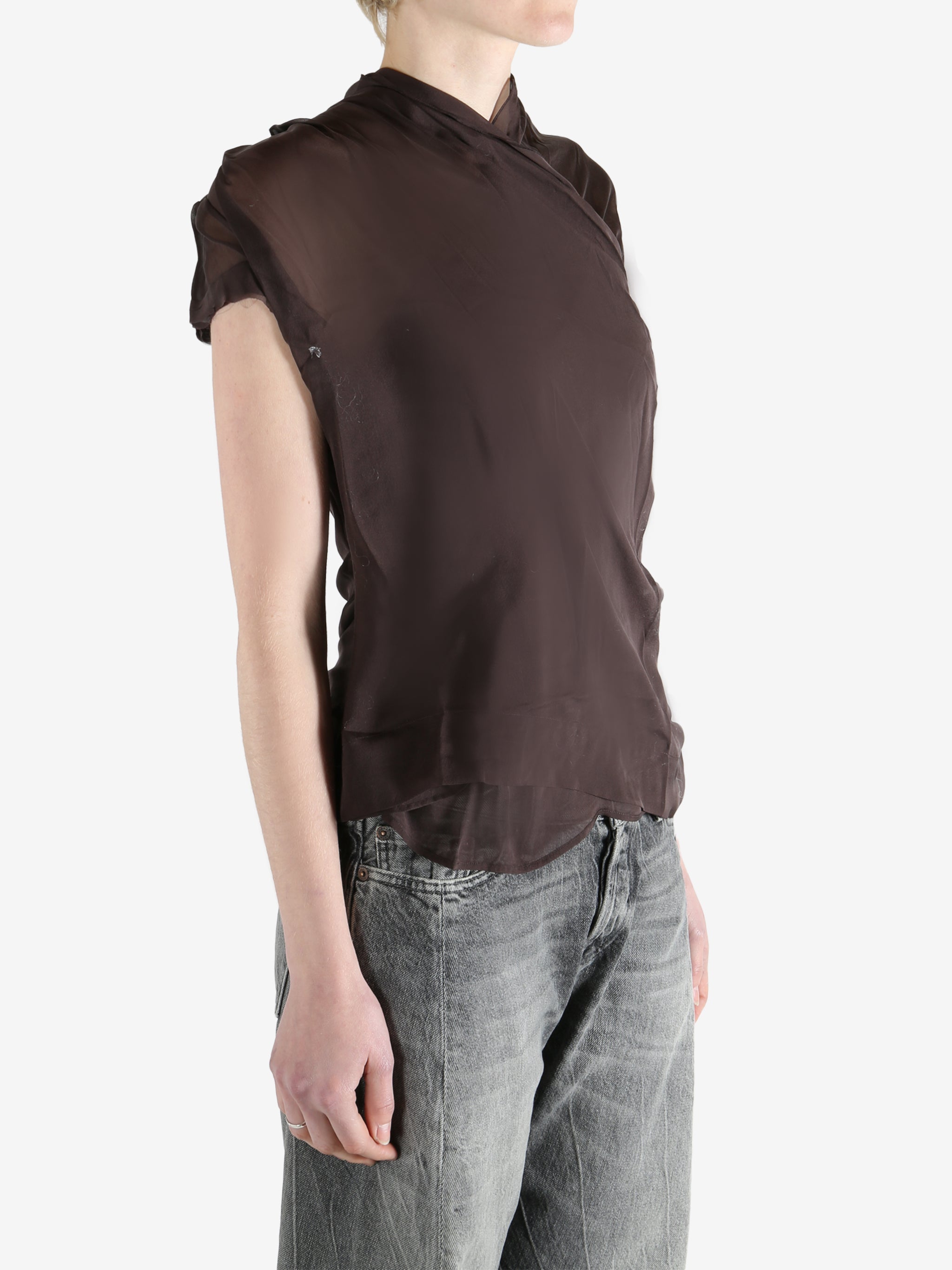 brown top worn by a person, showing the top fit