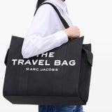 Black bag carried by a person, showing the bag’s fit
