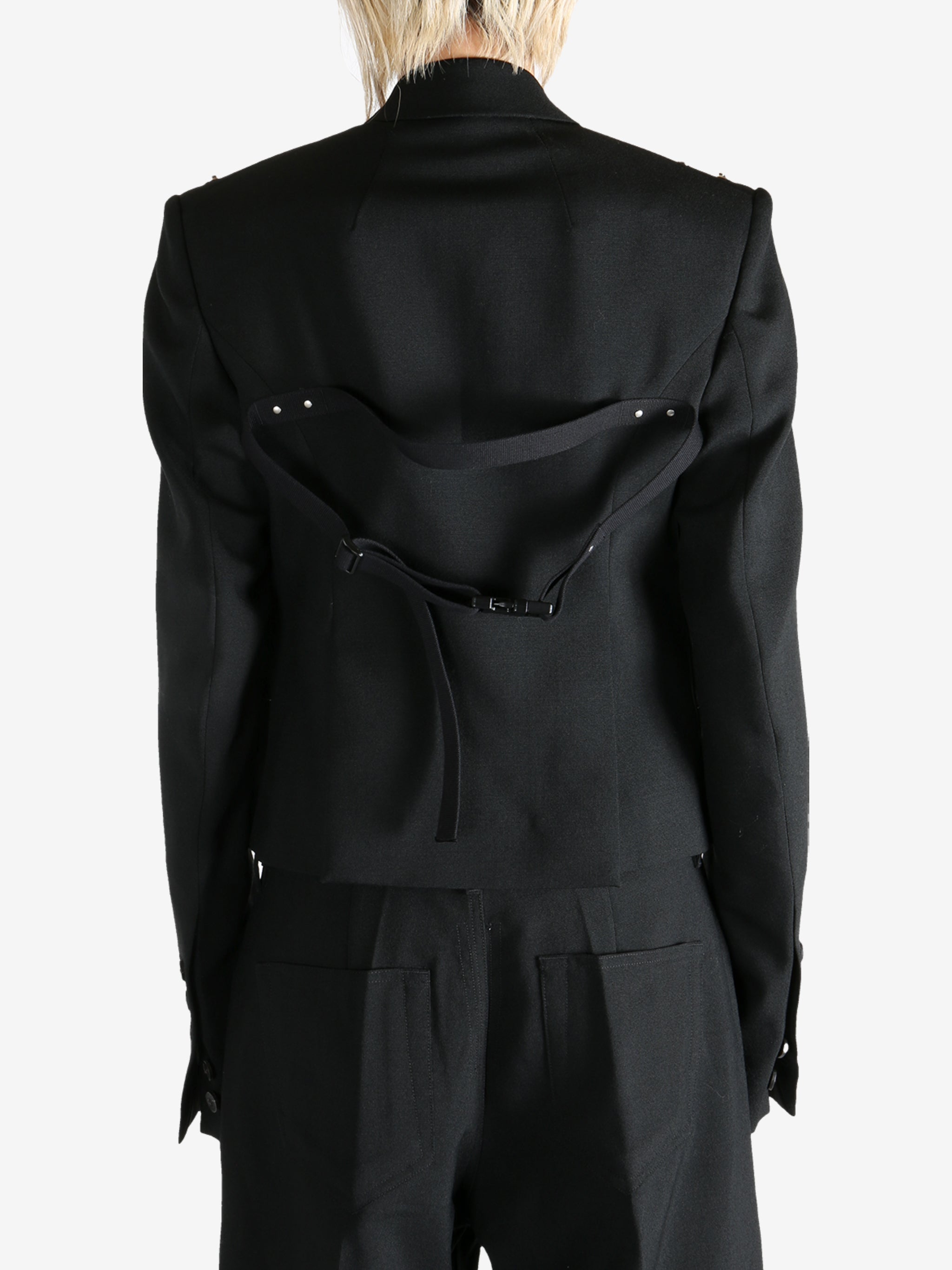 Black jacket worn by a person, showing the  jacket fit