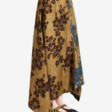 Tan skirt worn by a person, showing the skirt fit