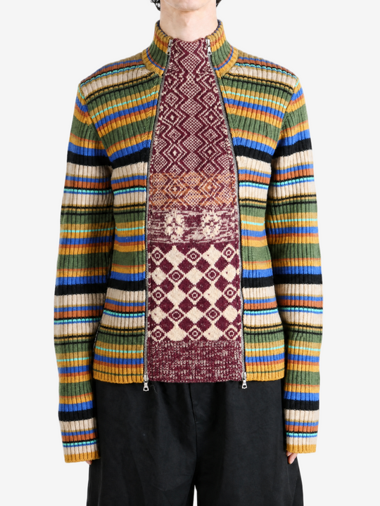 Burgundy knitwear worn by a person, showing the knitwear fit