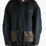 Black jacket worn by a person, showing the jacket's fit