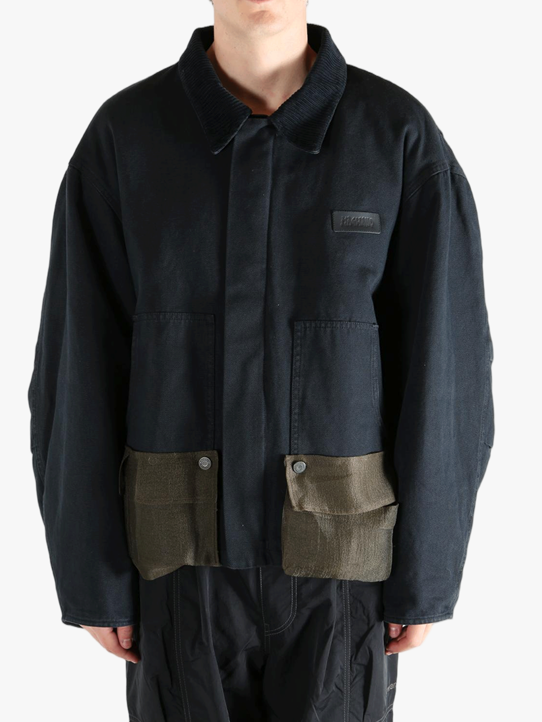 Black jacket worn by a person, showing the jacket's fit