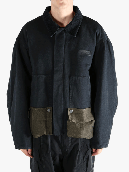 Black jacket worn by a person, showing the jacket's fit