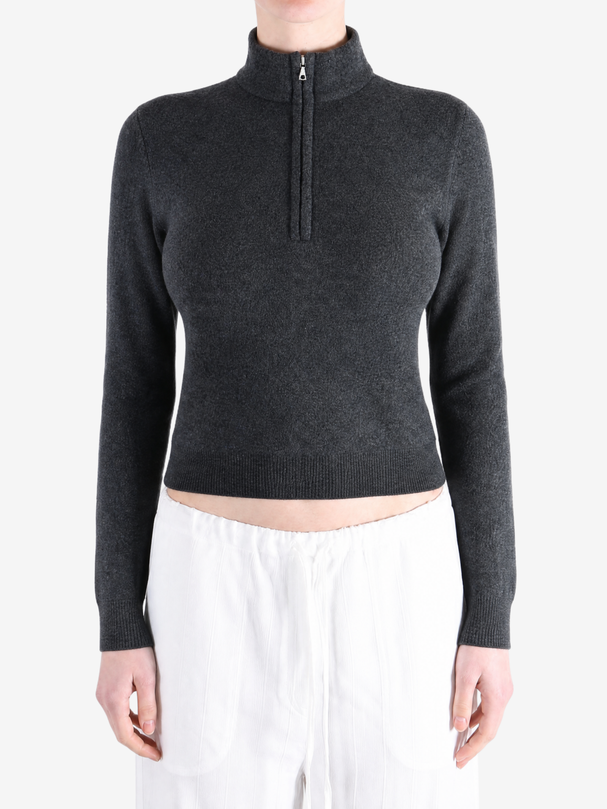Grey top worn by a person, showing the top fit