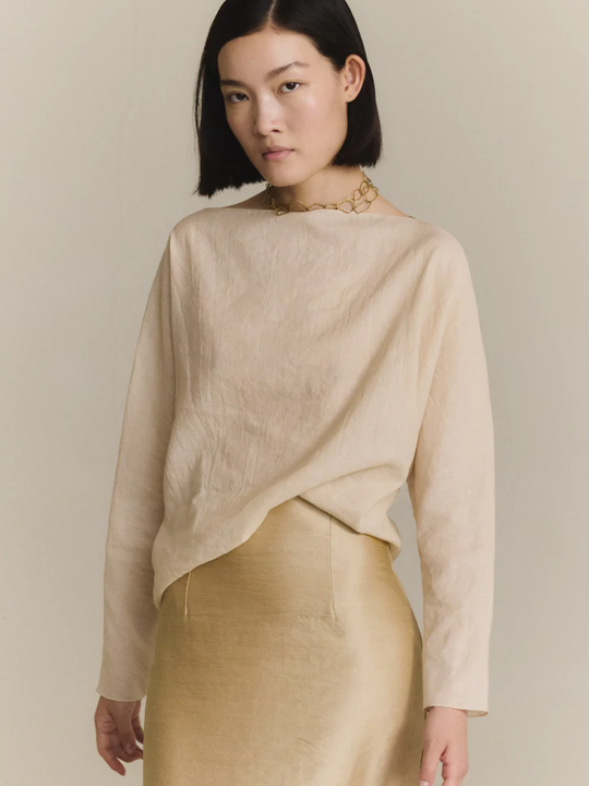 Tan top worn by a person, showing the top fit