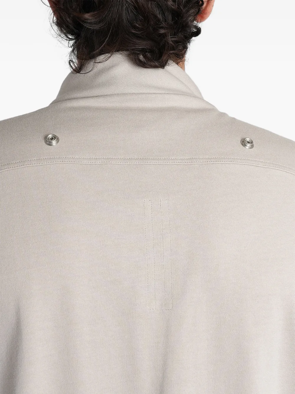 Grey t-shirt worn by a person, showing the t-shirt fit