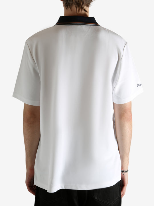 White shirt worn by a person, showing the shirt's fit